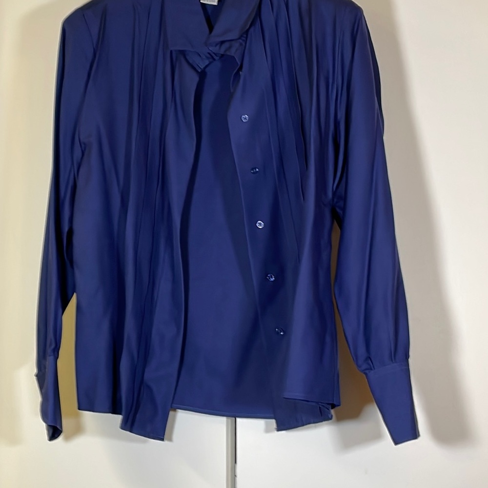 Such a beautiful dark blue silk blouse can be matched with your finest outfit